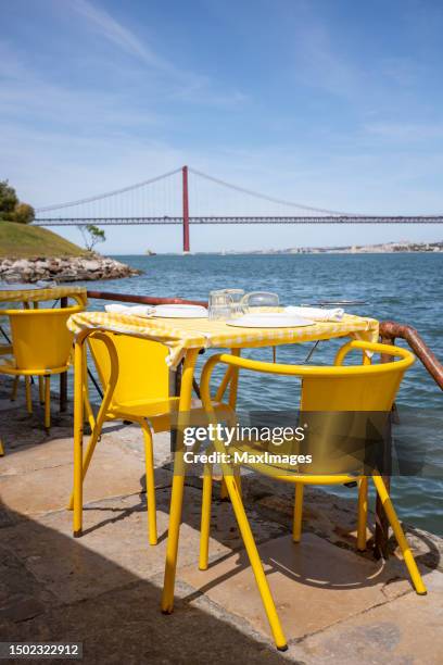 lisbon portugal - ponte 25 de abril restaurant chairs table food - lisbon food stock pictures, royalty-free photos & images