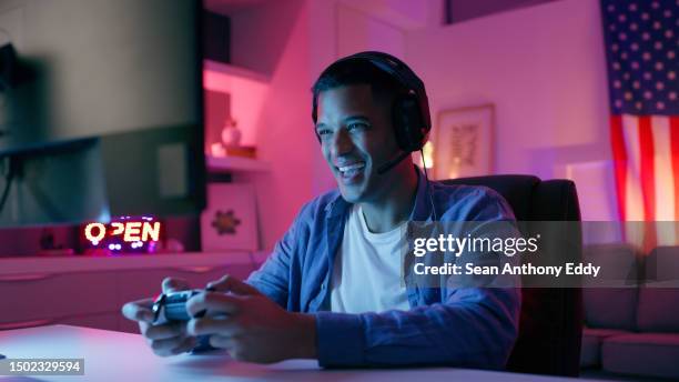 happy man, video game and headphones with live streaming and esports, computer and gamer playing in gaming room. technology, competition and winning with male person, cyber world and controller - man excited face stock pictures, royalty-free photos & images