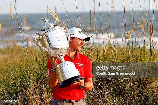 Rory McIlroy of Northern Ireland holds up the Wanamaker Trophy after winning the 94th PGA Championship at the Ocean Course on August 12, 2012 in...