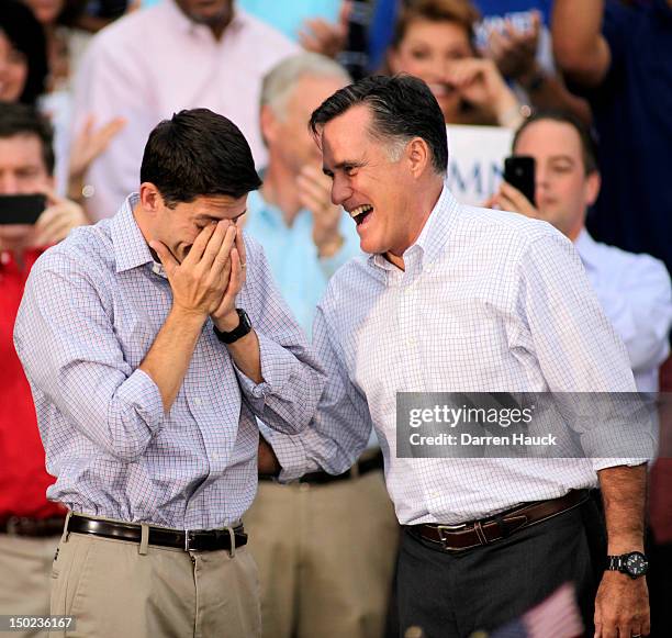 Republican vice presidential candidate and Wisconsin native Rep. Paul Ryan wipes away tears as he and presidential candidate and former Massachusetts...