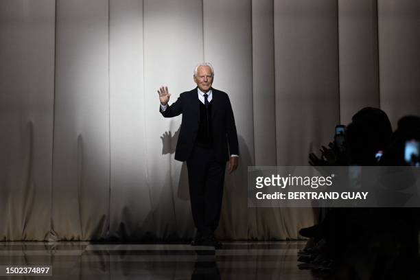Italian fashion designer Giorgio Armani acknowledges the audience at the end of the Giorgio Armani Prive show as part of the Women's Haute-Couture...