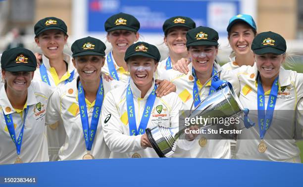 Australia captain Alyssa Healy holds aloft the trophy as Australia celebrate victory after day five of the LV= Insurance Women's Ashes Test match...
