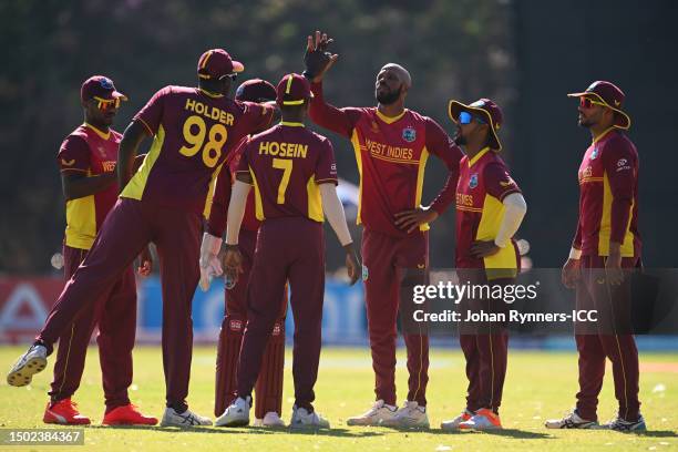 Roston Chase of West Indies celebrates with teammates after dismissing Max O'Dowd of Netherlands during the ICC Men's Cricket World Cup Qualifier...