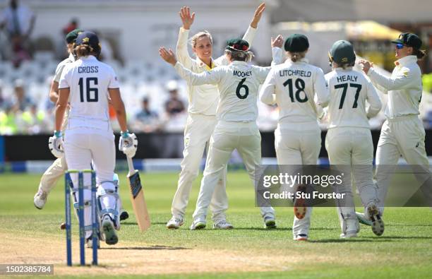 Australia bowler Ashleigh Gardner is congratulated by team mates after taking the wicket of Kate Cross during day five of the LV= Insurance Women's...