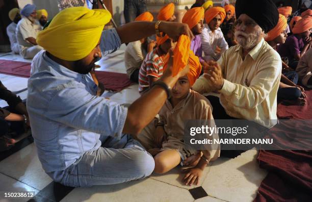 To go with AFP story India-culture-religion-Sikh-turban,FEATURE by Ammu Kannampilly This picture taken on July 7, 2012 shows Indian Sikh elders...