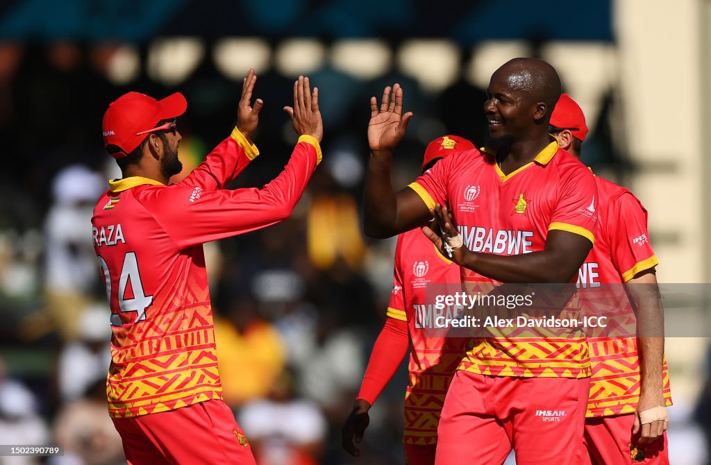 Luke Raza Luke Jongwe of Zimbabwe celebrates with teammate Sikandar Raza after ...