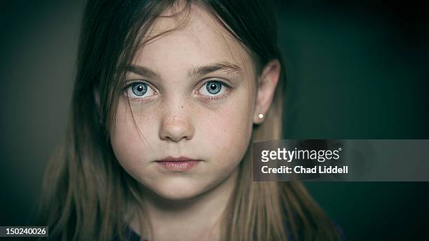 portrait of bright eyed young girl - girl sad stock pictures, royalty-free photos & images