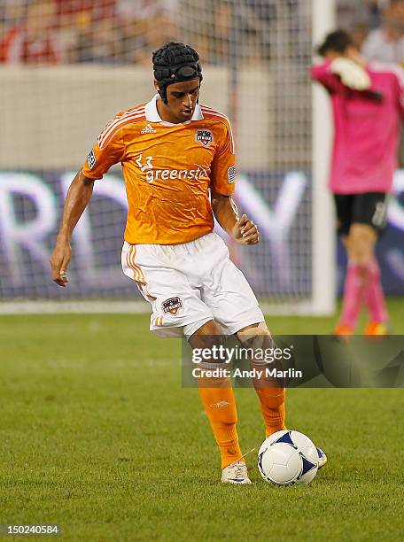 Calen Carr of the Houston Dynamo plays the ball against the New York Red Bulls during the match at Red Bull Arena on August 10, 2012 in Harrison, New...