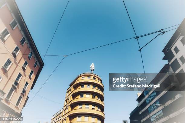 road crossing between the skyscrapers, seen from below - milan financial district stock pictures, royalty-free photos & images