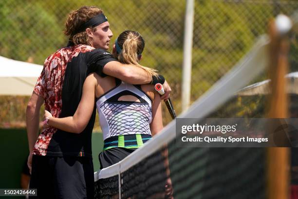 Stefanos Tsitsipas of Greece and Paula Badosa of Spain embrace after a practice session during day one of the Mallorca Championships 2023 at Mallorca...