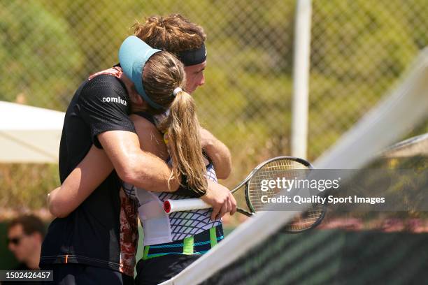 Stefanos Tsitsipas of Greece and Paula Badosa of Spain embrace after a practice session during day one of the Mallorca Championships 2023 at Mallorca...