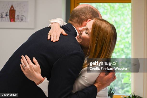 Prince William, Prince of Wales hugs Geri Halliwell during his visit to Maindee Primary School on June 26, 2023 in London, England. The Prince of...