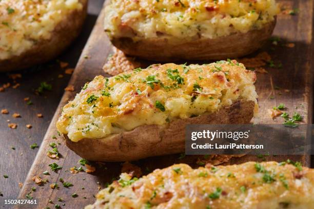 twice baked stuffed potatoes - melted cheese stock pictures, royalty-free photos & images