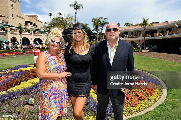Playboy and TV personality Josie Goldberg and her parents Leo and Alla root for her horse "Only Josie Knows" at Del Mar Thoroughbred Club on August...