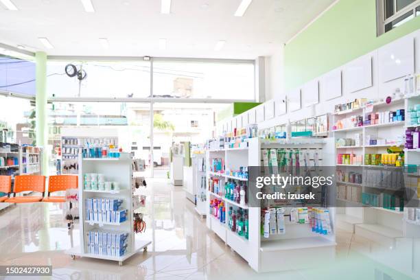 shelves with medicaments in pharmacy - pharmacy stock pictures, royalty-free photos & images