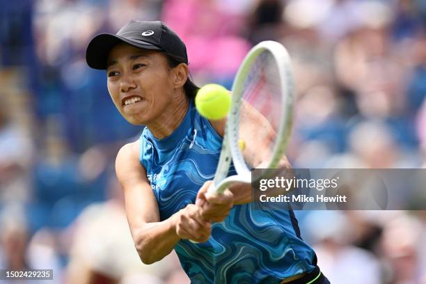 Zhang Shuai of China plays a backhand against Harriet Dart of Great Britain in the Women's Singles First Round match during Day Three of the Rothesay...