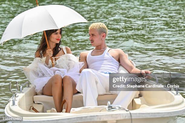 Emily Ratajkowski and Aron Piper attend the "Le Chouchou" Jacquemus' Fashion Show at Chateau de Versailles on June 26, 2023 in Versailles, France.