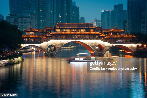 chengdu's illuminated anshun bridge with reflection - sichuan province stock pictures, royalty-free photos & images