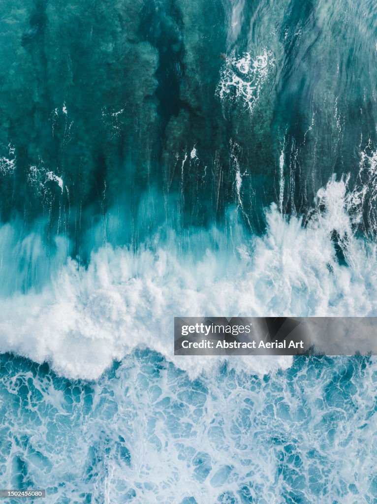 Drone image showing a breaking Ocean wave, Uluwatu, Bali, Indonesia