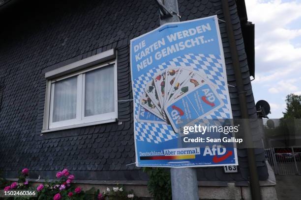 Local election campaign poster for the right-wing Alternative for Germany reads: "The cards are being remixed . . . " on June 26, 2023 in Sonneberg,...