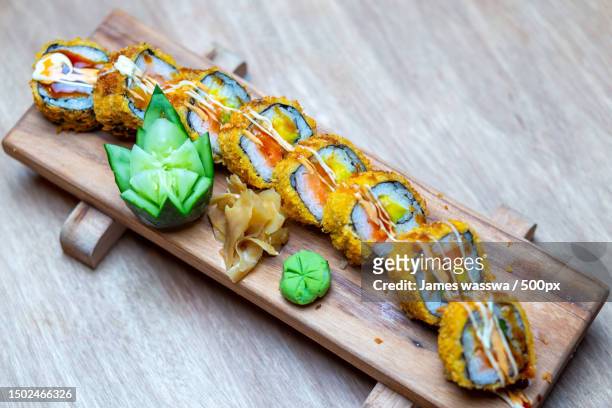 close-up of food on cutting board,uganda - national diet of japan stock pictures, royalty-free photos & images