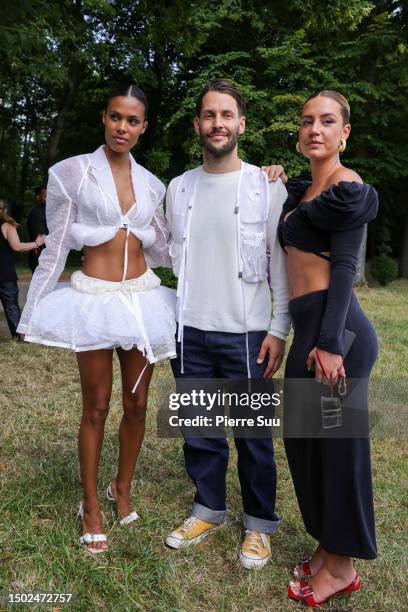 Tina Kunake ,Simon Porte Jacquemus and Adèle Exarchopoulos are seen during the "Le Chouchou" Jacquemus' Fashion Show at Chateau de Versailles on June...