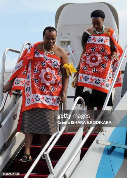 King of Swaiziland Mswati III and wife Inkhosikati Make Mahlangu disembark at the Bandaranaike International Airport in Katunayake on August 13,2012....