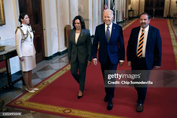 Vice President Kamala Harris, President Joe Biden and Jeff Say walk into the East Room for an event in the East Room of the White House on June 26,...