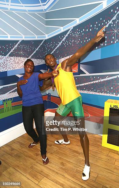 Jennifer Bolt visits the wax figure of her son Usain Bolt after his triple gold London 2012 Olympic success at Madame Tussauds on August 13, 2012 in...