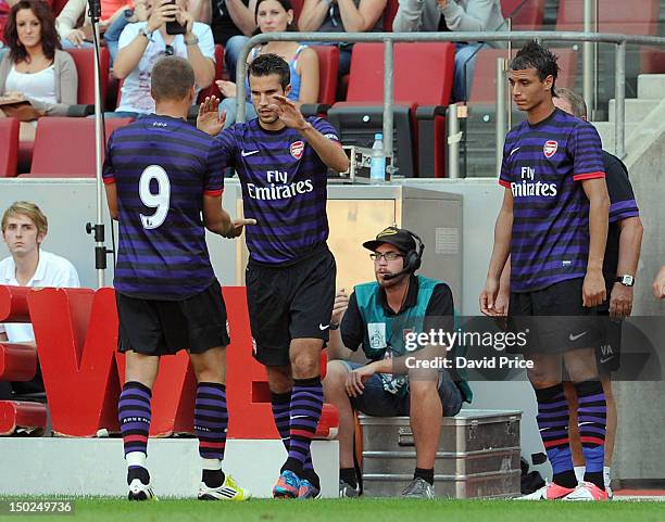 Robin van Persie of Arsenal coomes on to replace Lukas Podolski against FC Cologne during Pre-Season Friendly game at Rhein Energie Stadium on August...