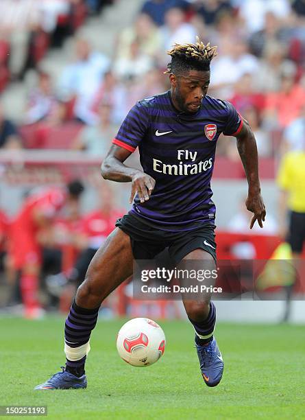 Alex Song of Arsenal in action against FC Cologne during a Pre-Season Friendly game at Rhein Energie Stadium on August 12, 2012 in Cologne, Germany.