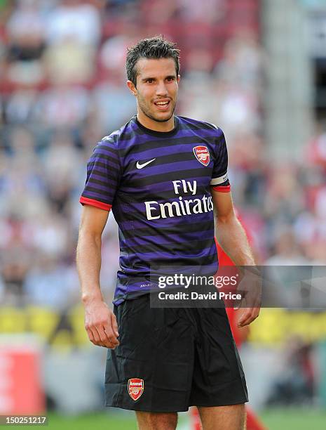 Robin van Persie of Arsenal in action against FC Cologne during Pre-Season Friendly game at Rhein Energie Stadium on August 12, 2012 in Cologne,...