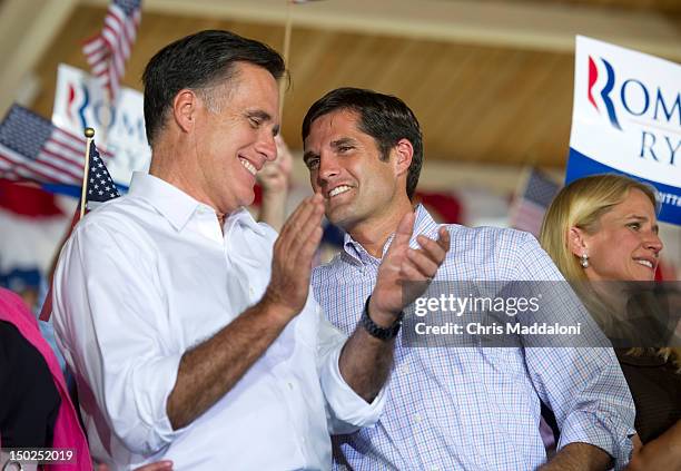 Presidential candidate Mitt Romney speaks to his son, Matt, at a rally in Manassas during his “Plan For A Stronger Middle Class" bus tour in...