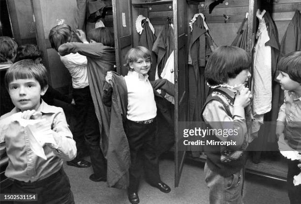 There is a controlled scramble as the boys get into their surplices and collars ready to troop out ot the choir stalls of St. Nicholas Cathedral in...