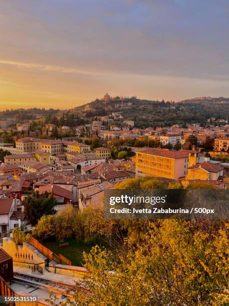 high angle view of townscape against sky at sunset,verona,italy - verona italy stock pictures, royalty-free photos & images