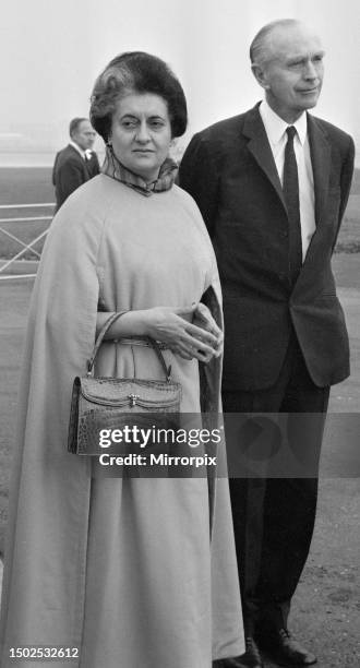 Indian Prime Minister Mrs Indira Gandhi seen here being greeted by Foreign Secretary Sir Alec Douglas Home at the start of her five day visit to the...