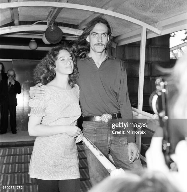 Carole King and James Taylor, both singer/songwriters, together for a press conference at The Hispanola Restaurant on the Thames Embankment in...