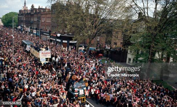 Cup Final at Wembley StadiumArsenal 2 v Liverpool 1The Arsenal team parade the FA Cup trophy to their fans from an open top double decker bus during...