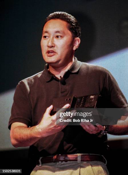 Kaz Hirai, Chief Operating Officer of Sony Computer Entertainment America holds the Sony PlayStation 2 unit that was announced eight-months ago as he...