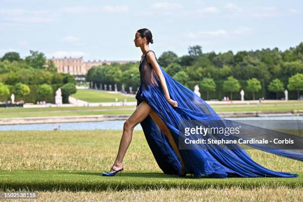 Model walks the runway during "Le Chouchou" Jacquemus' Fashion Show at Chateau de Versailles on June 26, 2023 in Versailles, France.