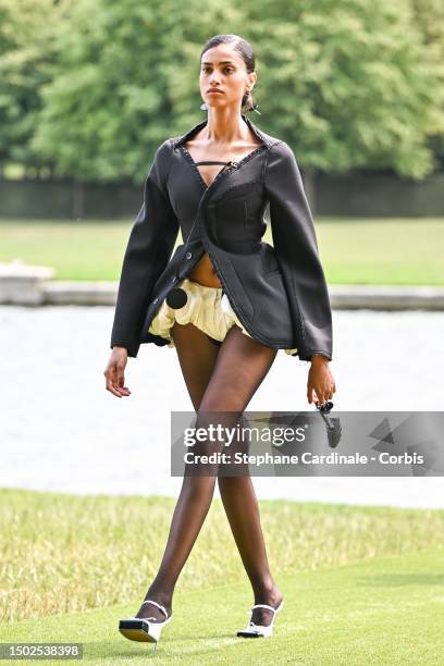 Model walks the runway during "Le Chouchou" Jacquemus' Fashion Show at Chateau de Versailles on June 26, 2023 in Versailles, France.