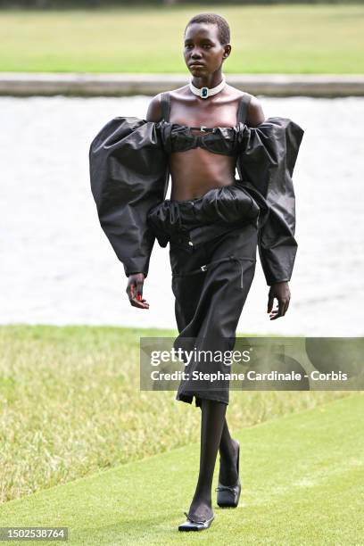 Model walks the runway during "Le Chouchou" Jacquemus' Fashion Show at Chateau de Versailles on June 26, 2023 in Versailles, France.