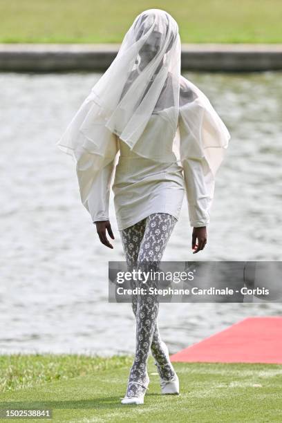 Model walks the runway during "Le Chouchou" Jacquemus' Fashion Show at Chateau de Versailles on June 26, 2023 in Versailles, France.