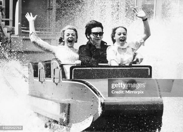 Roy Orbison at the Battersea Pleasure Gardens, accompanied by two go-go dancers from the London Palladium. 28th May 1970 .