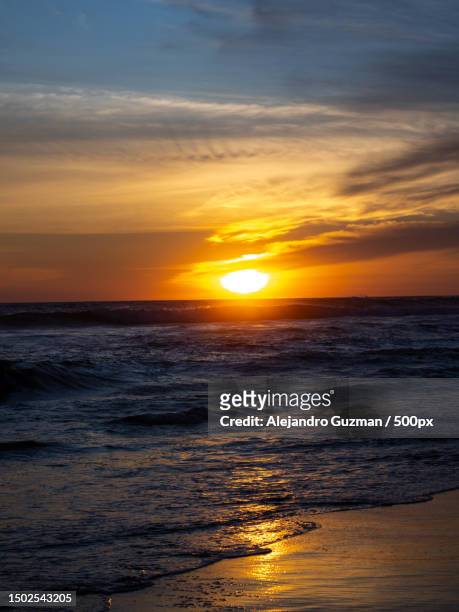 scenic view of sea against sky during sunset - guzman stock pictures, royalty-free photos & images