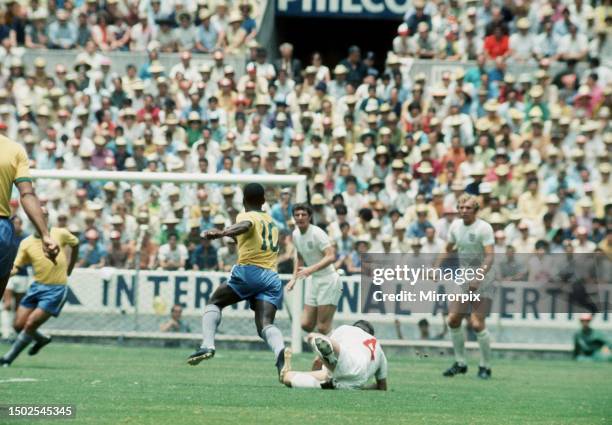 Brazil versus England. Pele evades a tackle from Alan Mullery. 7th June 1970.