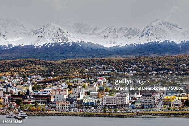aerial view of townscape by sea against sky,ushuaia,argentina - ushuaia stock-fotos und bilder