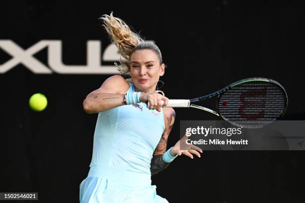 Tereza Martincova of Czech Republic plays a forehand against Madison Keys of United States in the Women's First Round match during Day Three of the...