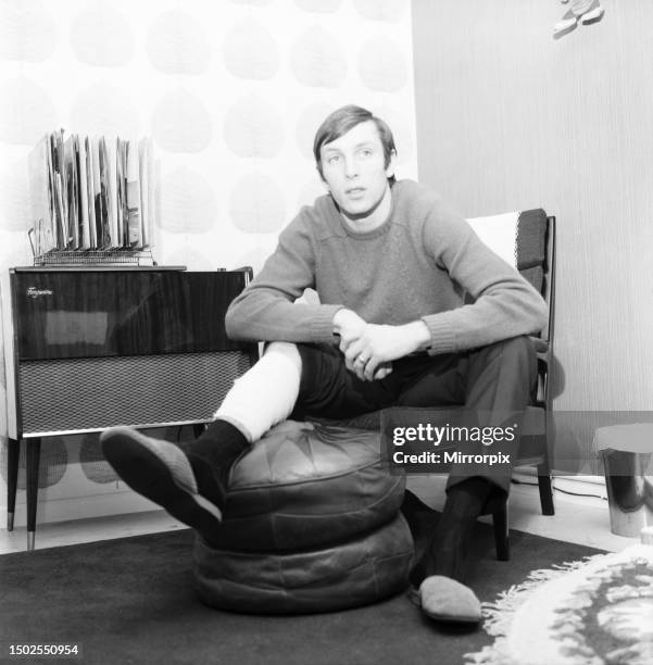 Alan Stephenson West ham centre half rests dejectedly after his leg injury, caused by a clash with Everton's centre forward Joe Royle in yesterday's...