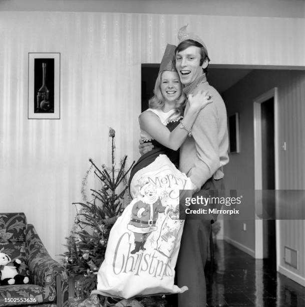 Work as usual. West Ham centre half Alan Stephenson who is recovering from a gashed leg, pictured at his Addington home, Surrey having an early...